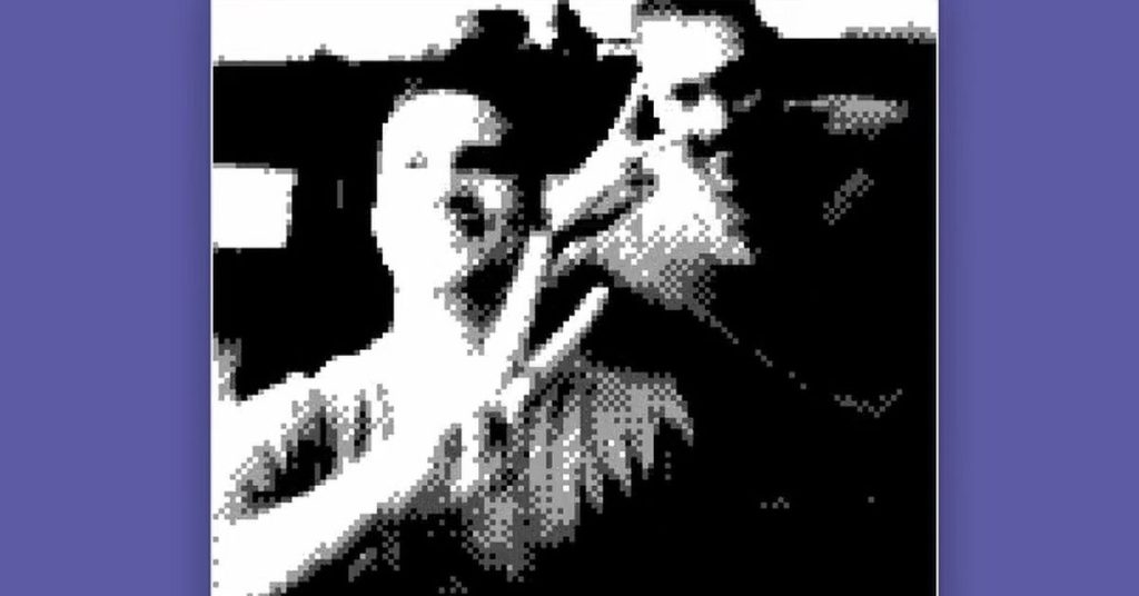 A low-resolution image of two people being livestreamed through the Game Boy Camera.